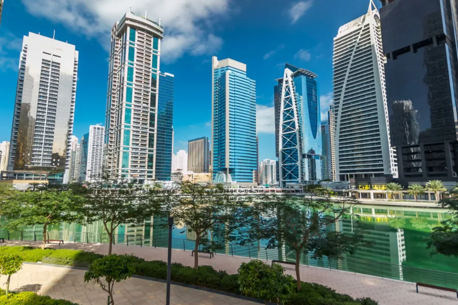 Towers and lakeside park in Dubai