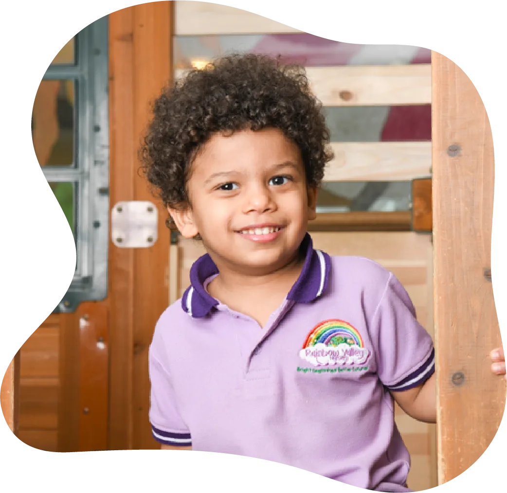 Child in nursery uniform sitting in the classroom