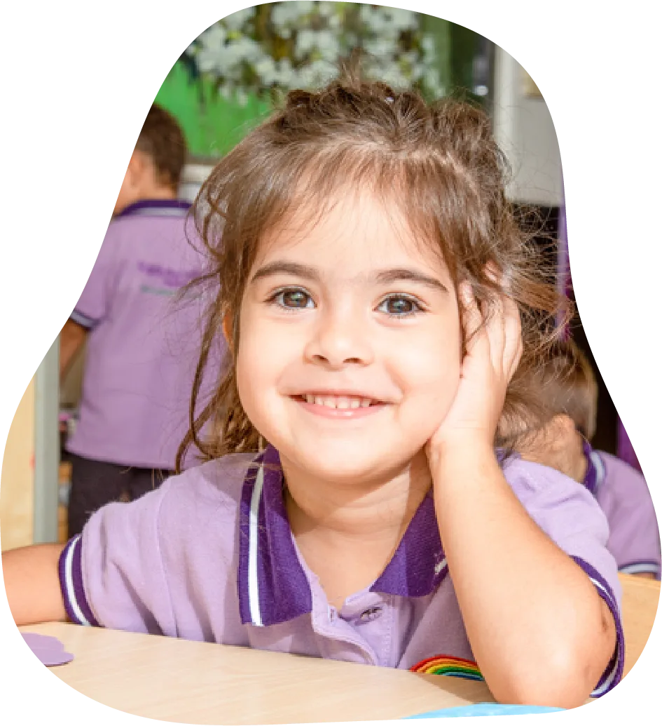 Smiling girl resting her chin on her hands