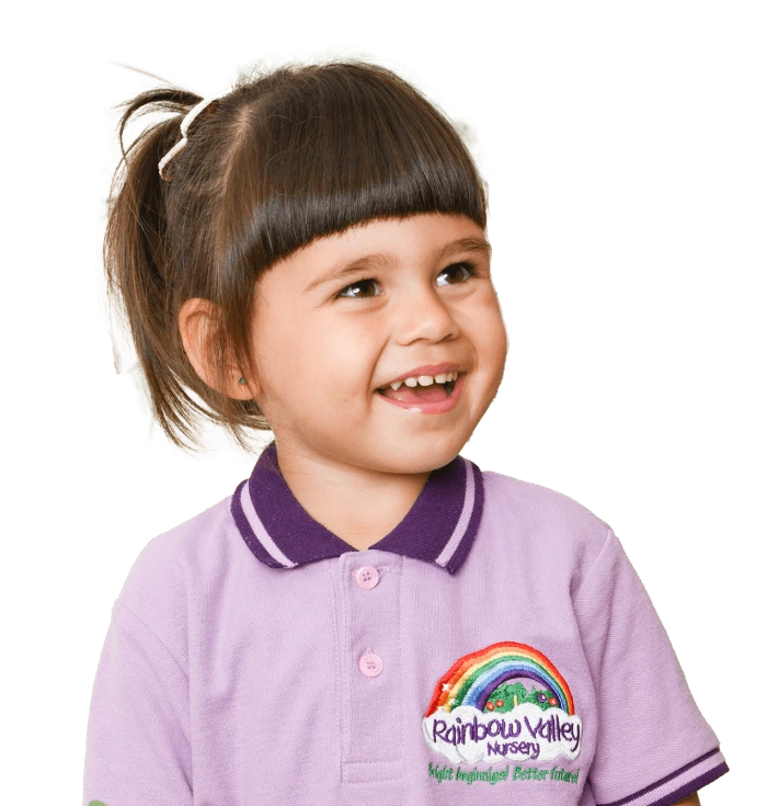 Smiling girl in Rainbow Valley Nursery uniform