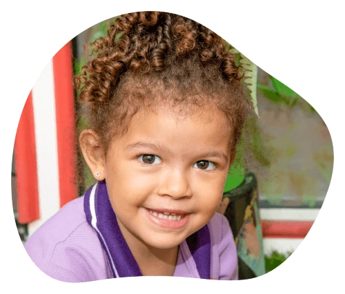 Smiling girl in Rainbow Valley Nursery uniform